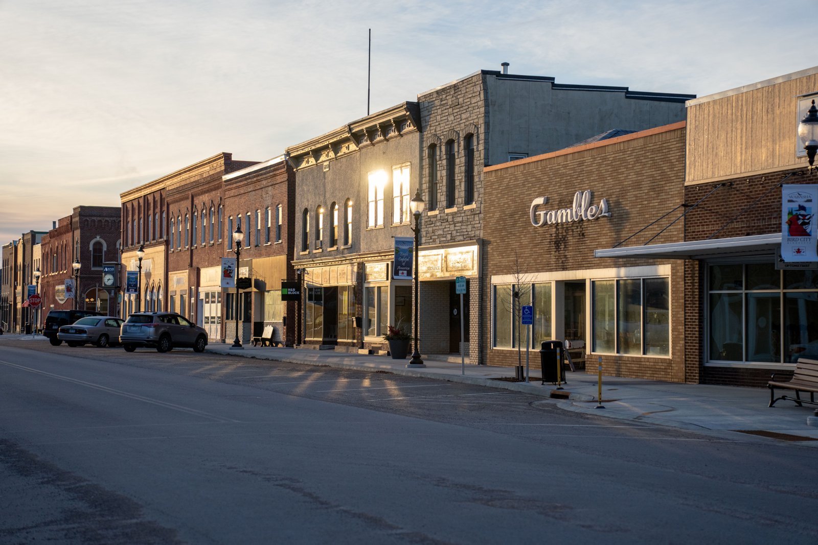 Historic small-town main street with brick storefronts at sunset - Living in West Reading PA guide